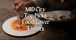 Chef arranging a gourmet dish on a white plate during a culinary event.