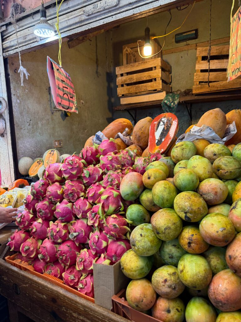 Fruit display stand with mango, dragon fruit and papaya